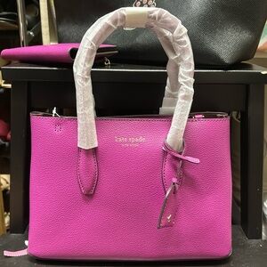 NWT beautiful small top zip satchel. Never used. Excellent condition.